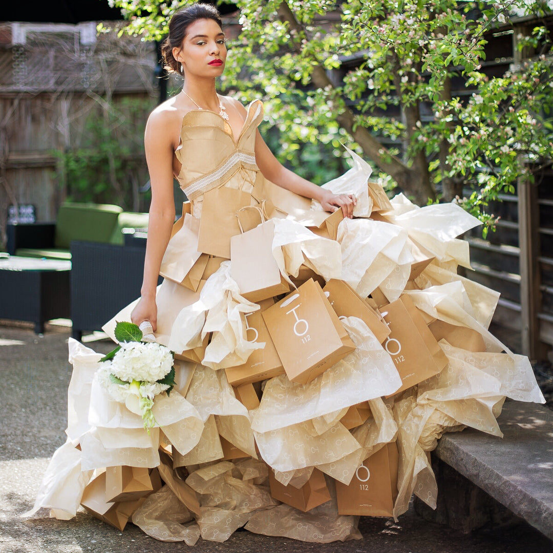 woman wearing dress made from TO112 recycled paper bags 