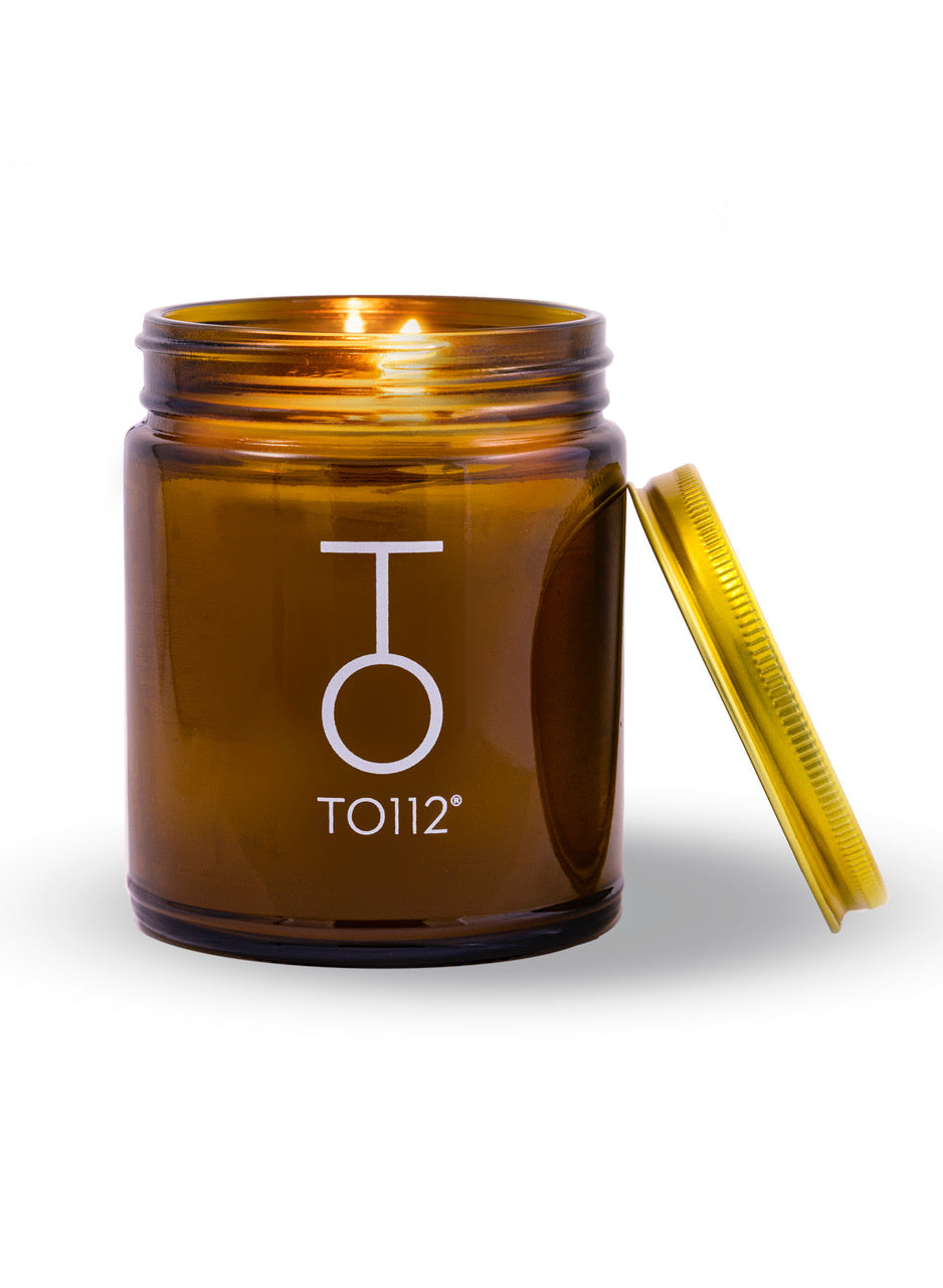 To112 all natural beeswax candle with gold lid beside