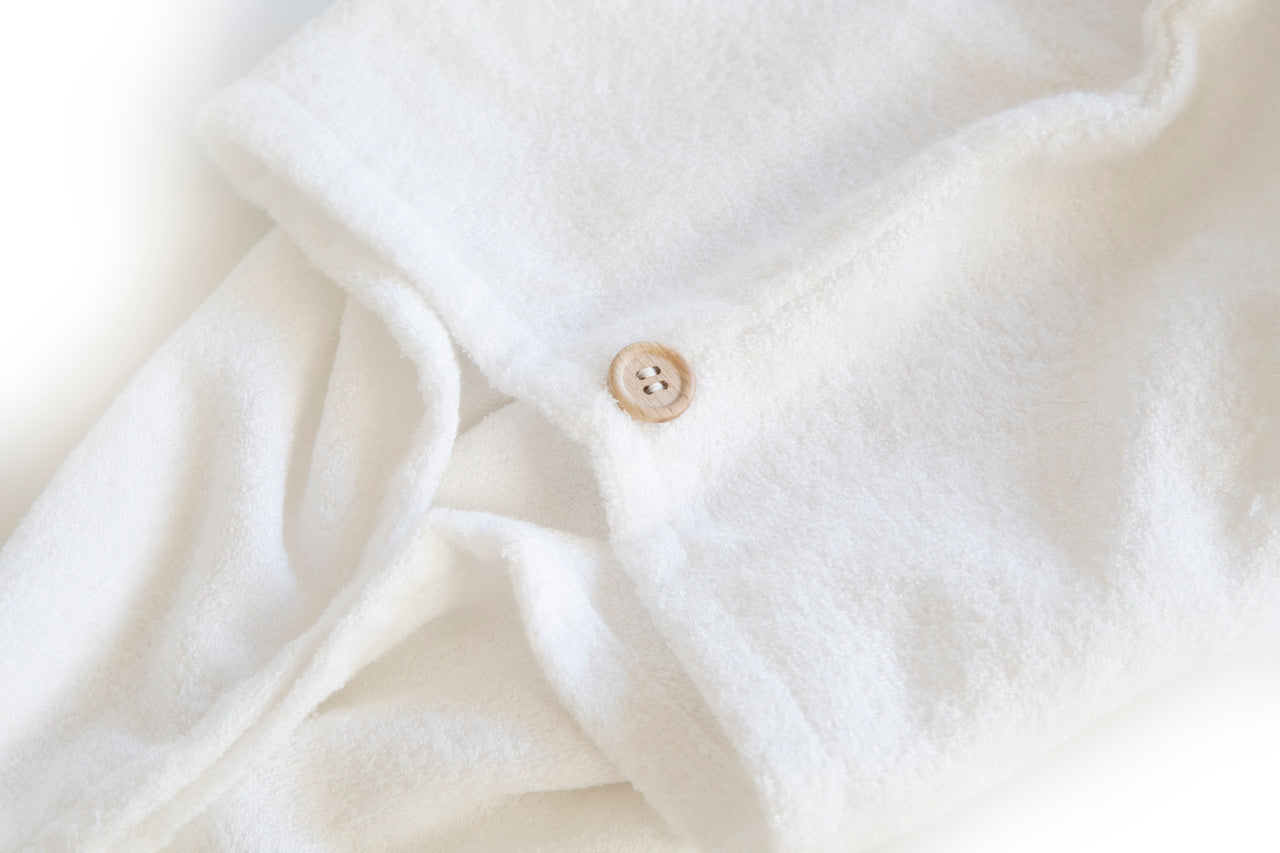 Close-up detail of To112 Bamboo Hair Towel button detail
